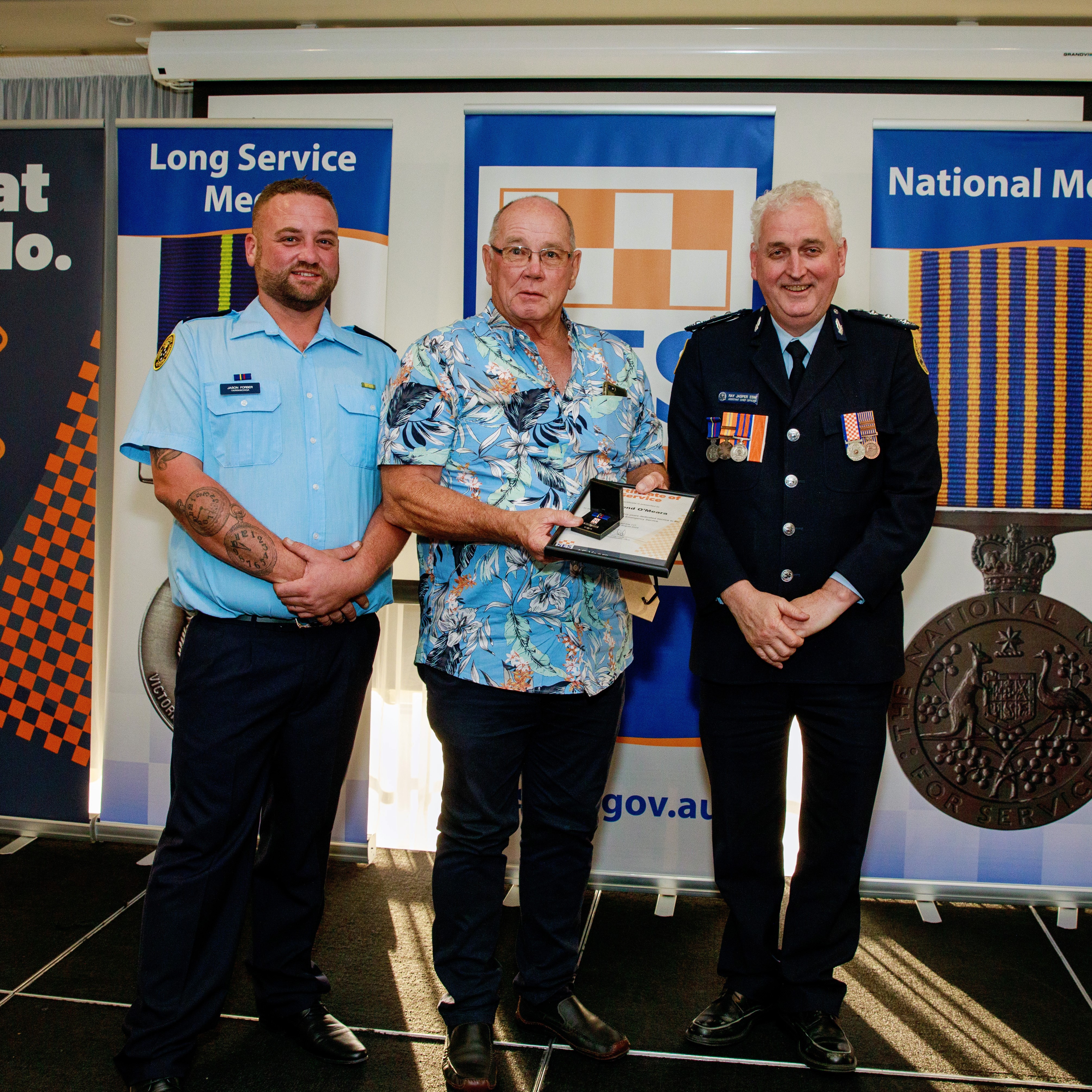 Desmond O'Meara (centre) was recognised for more than 45 years of service to the VICSES Yarrawonga Unit.