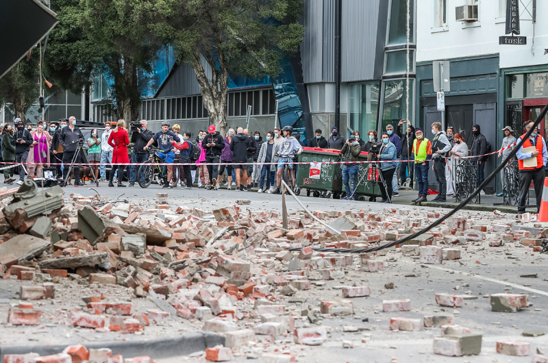 A large pile of bricks, debris from the earthquake, highlighting the destruction caused.